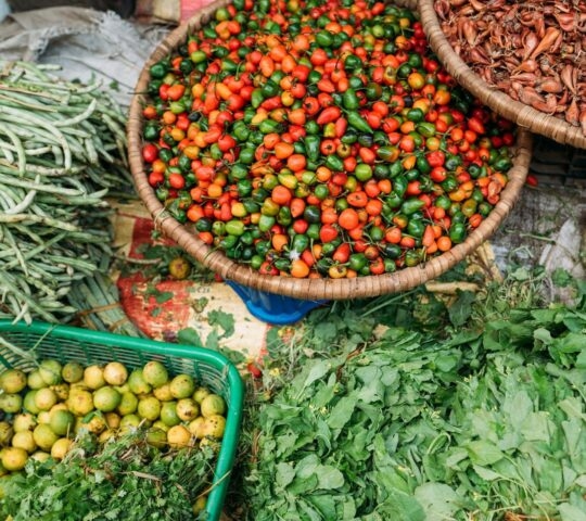 Street market still life top view image on the Kathmandu city, Nepal. Fresh vegetables and spices lying right on the path