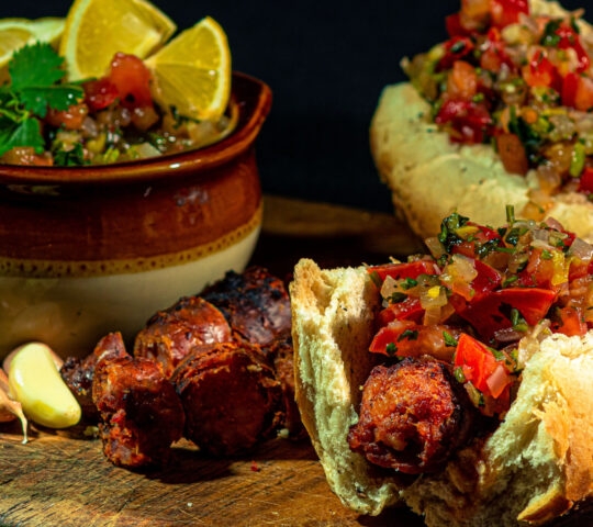 traditional chilean choripan and bowl with pebre