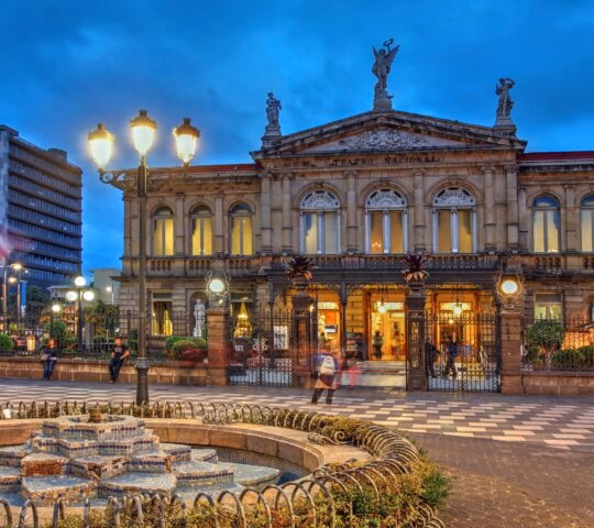 Night scene of the square in front of the National Theatre of Costa Rica in San Jose at twilight time.