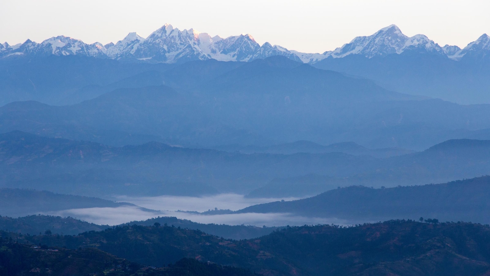 A view of the sun rising over the Himalayas from Dhulikhel, Nepal