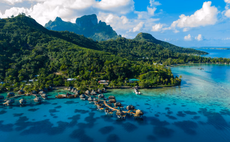 Bora Bora aerial drone image of travel vacation paradise and overwater bungalows