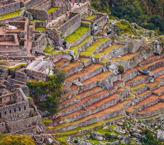 Aerial view of Machu Picchu's ancient ruins and terraces in Peru.
