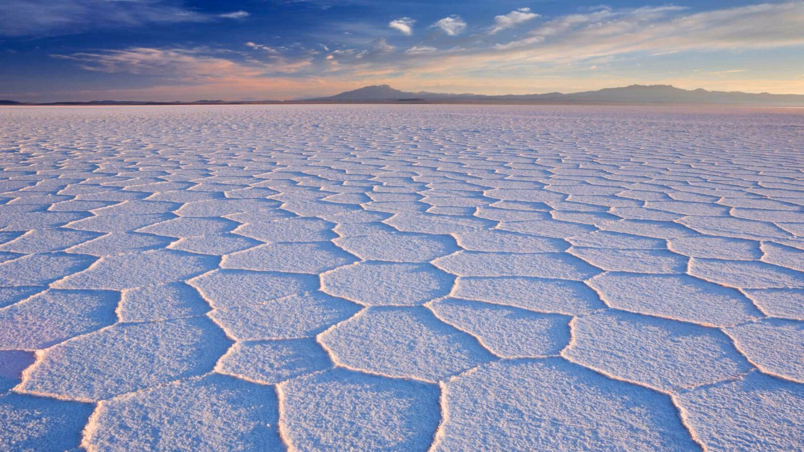 Salt flat Salar de Uyuni in Bolivia at sunrise