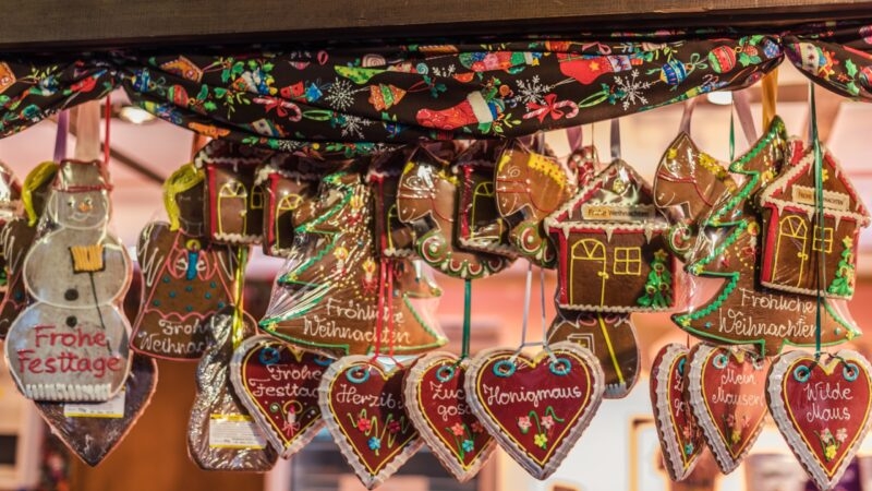 Vienna, Austria - December 24, 2017. Traditional gingerbread hearts, houses, snowman and angel at Viennese Christmas Market. Close view of Xmas fair kiosk selling sweets.