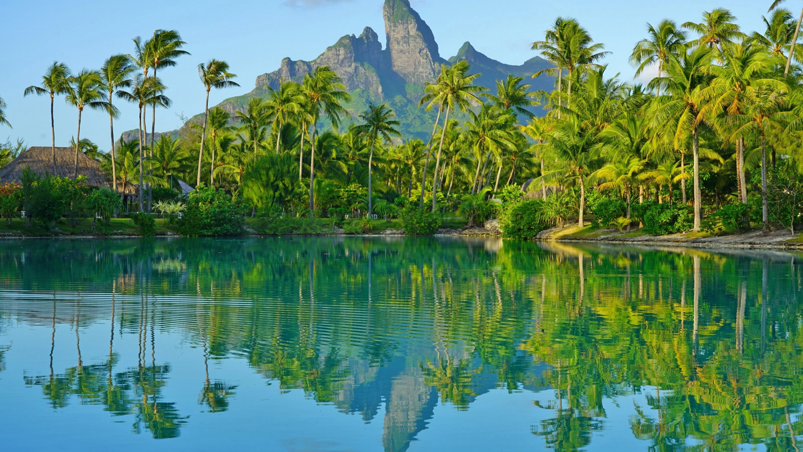 View of the Mont Otemanu mountain reflecting in water at sunset in Bora Bora, French Polynesia, South Pacific