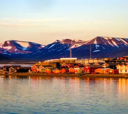 Midnight sun on the Longyearbyen waterfront in Svalbard in the Norwegian arctic