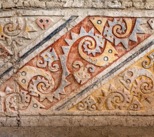 Colourful patterns on a wall in El Brujo, Trujillo, Peru