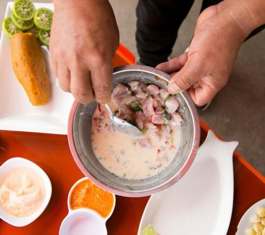 Luxury Peru Tours - A man making ceviche in Peru