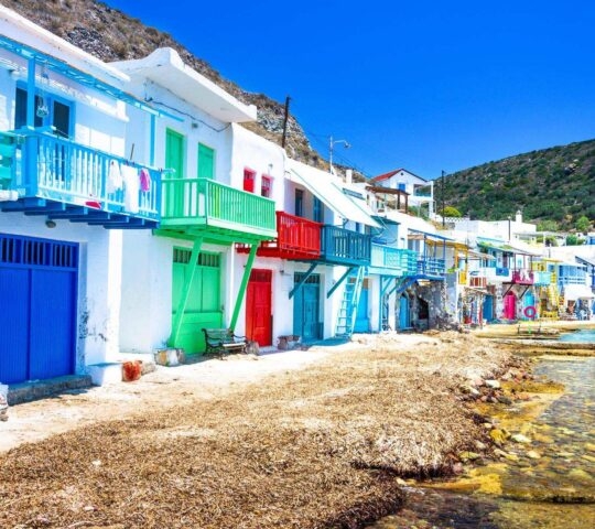 Colourful village by the sea in Milos