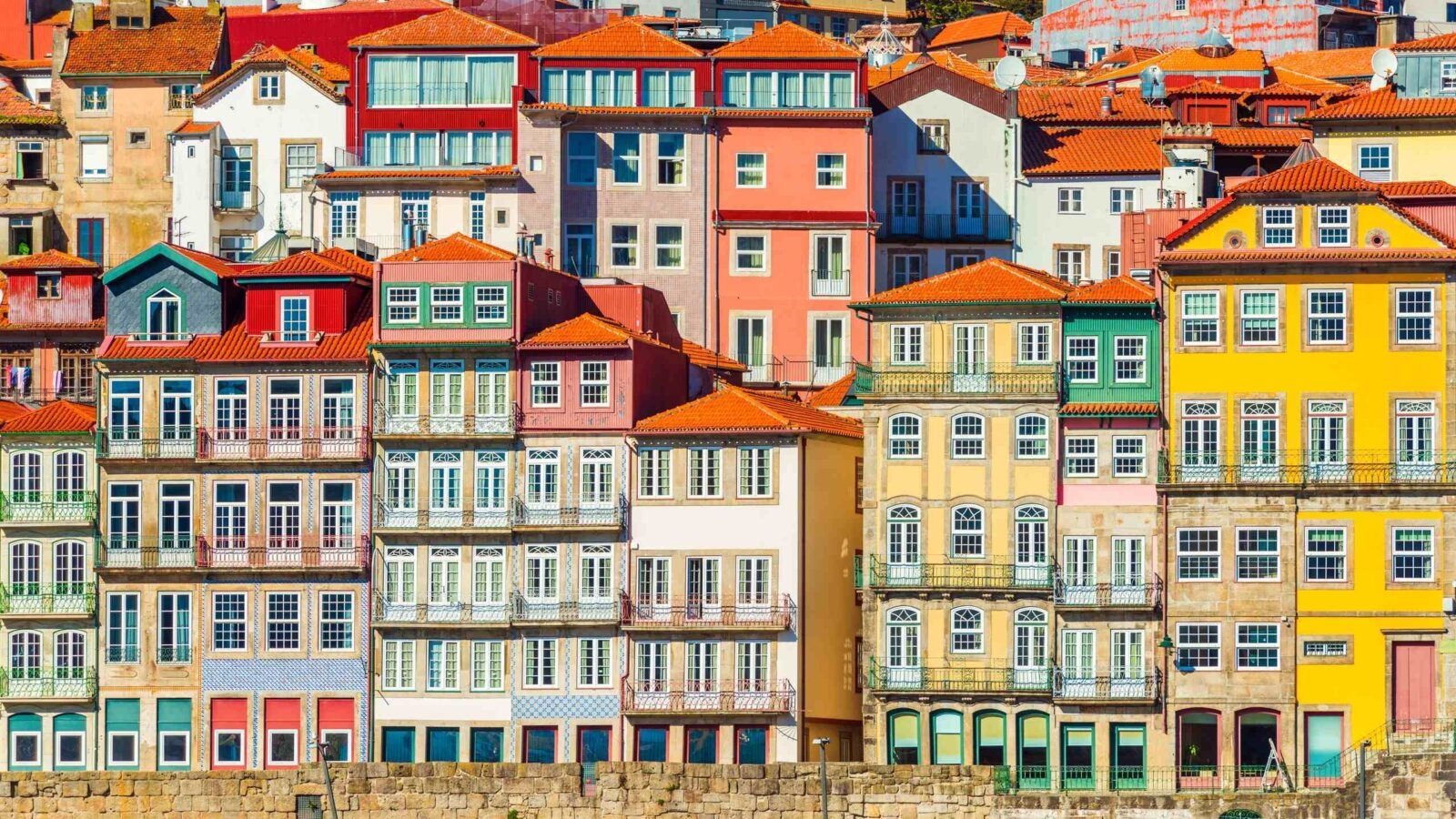 Rows of colorful buildings in traditional architectural style in Porto, Portugal