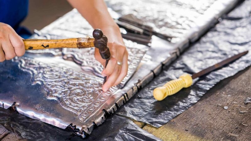 Thai artisan making silverware, Chiang Mai, Thailand