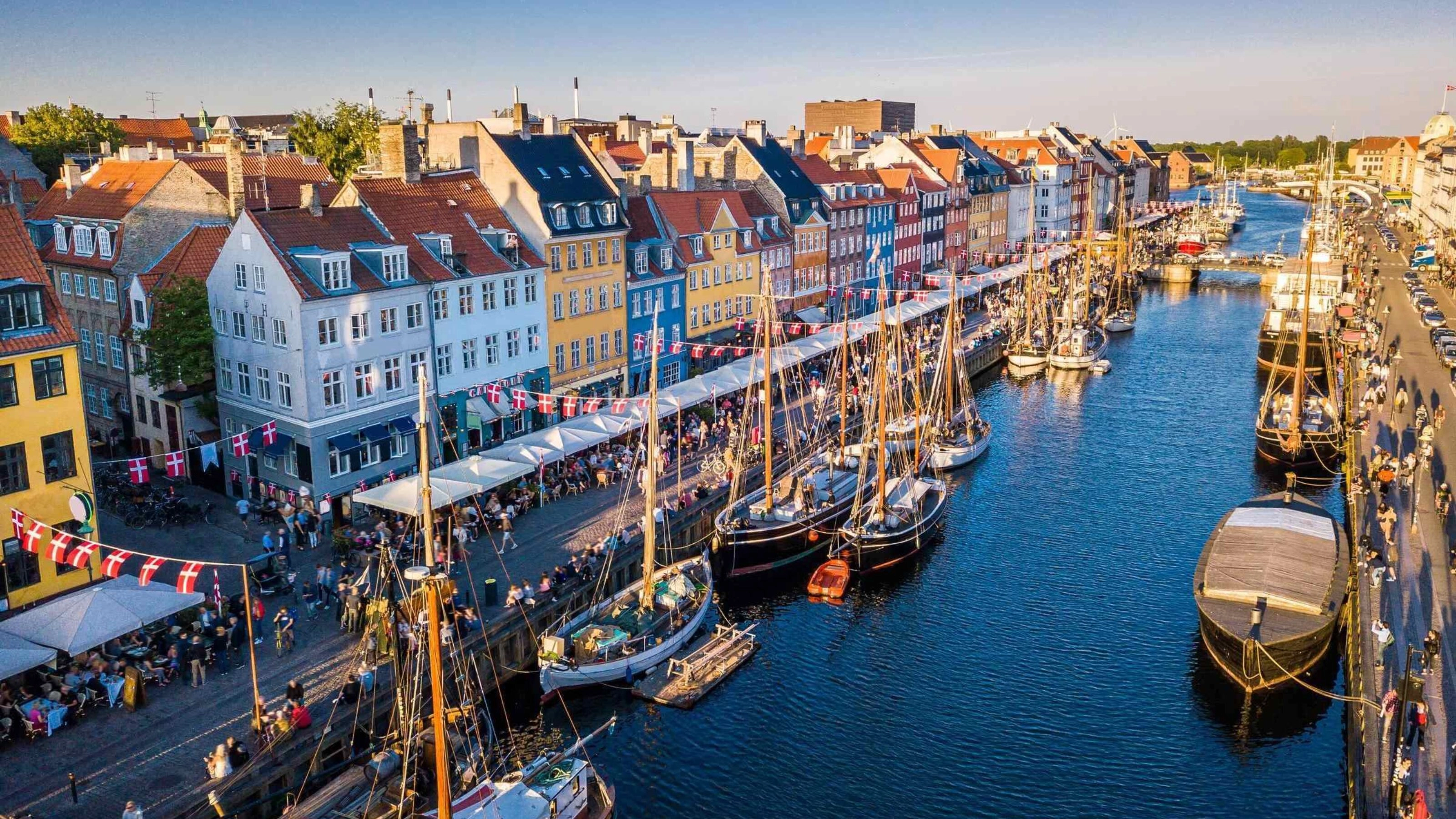 A canal with boats harboured in Copenhagen, Denmark