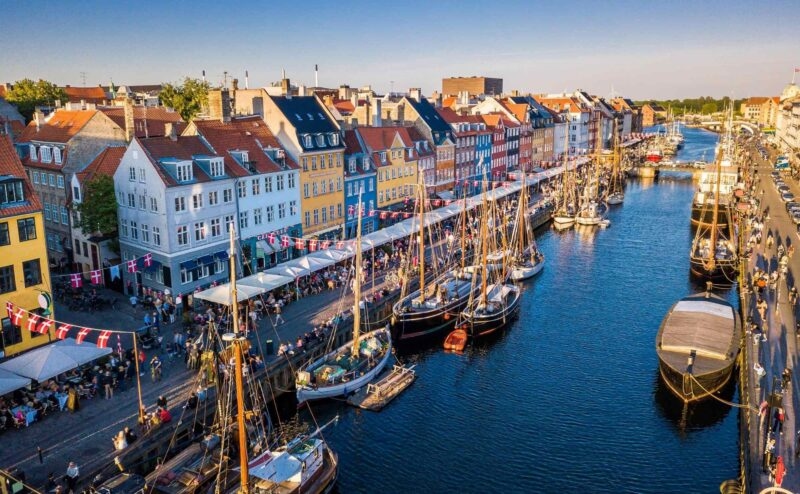A canal with boats harboured in Copenhagen, Denmark