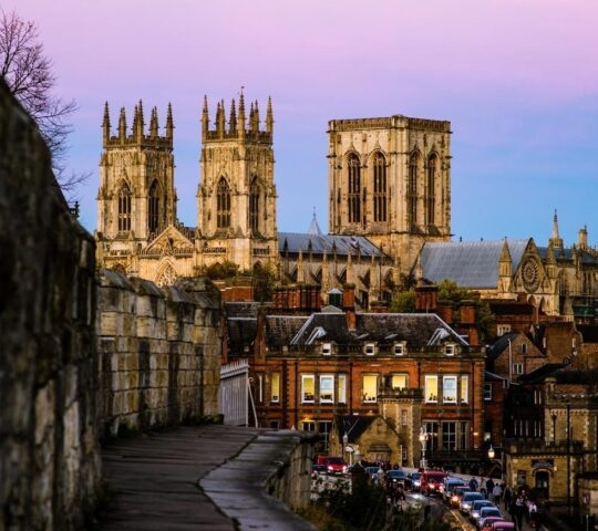 The York Minster and city walls at sunset