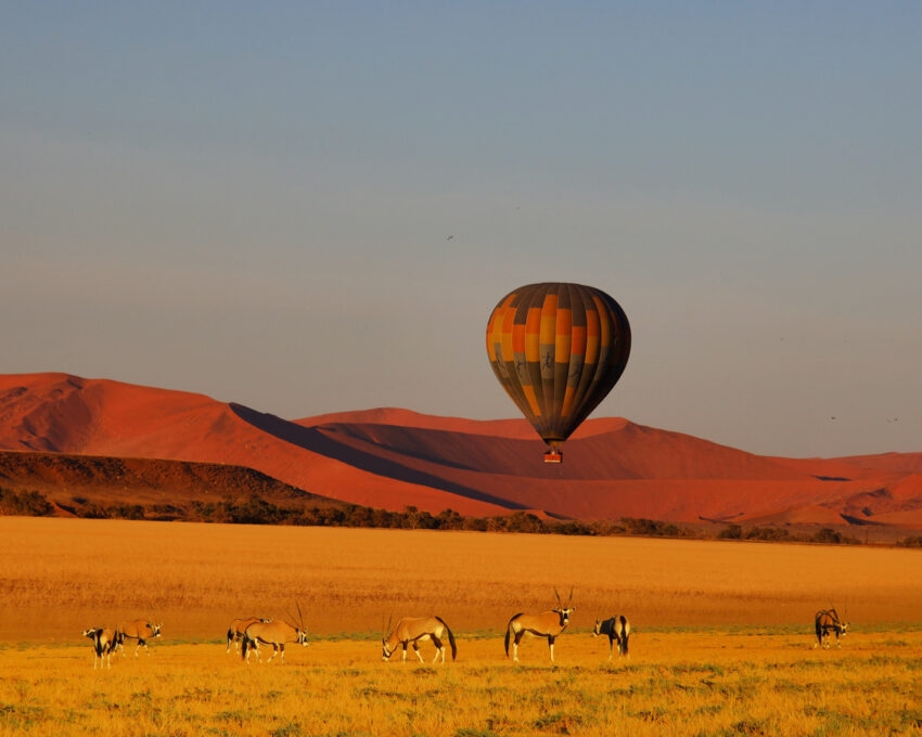 A hot air balloon flying over Sossusvlei in Namibia
