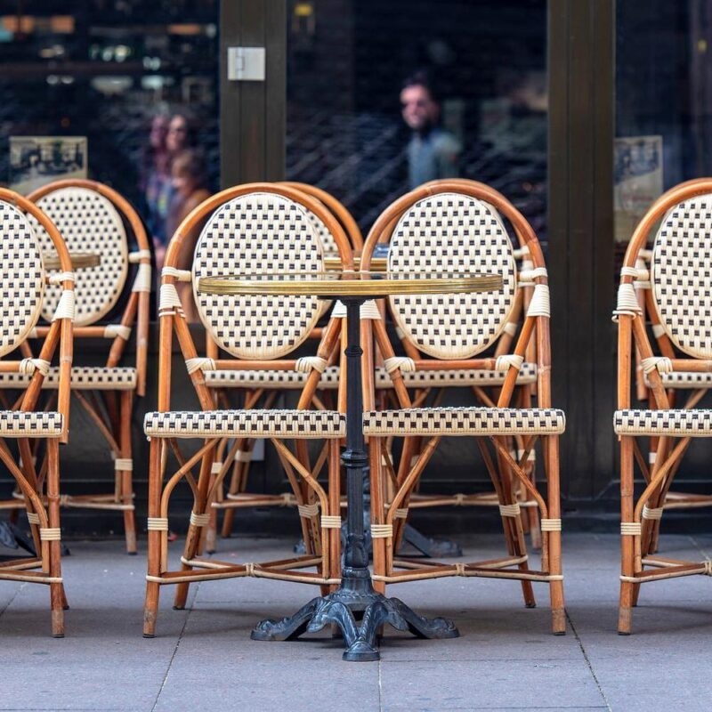 Chairs lined up on the pavement outside a cafe in Paris
