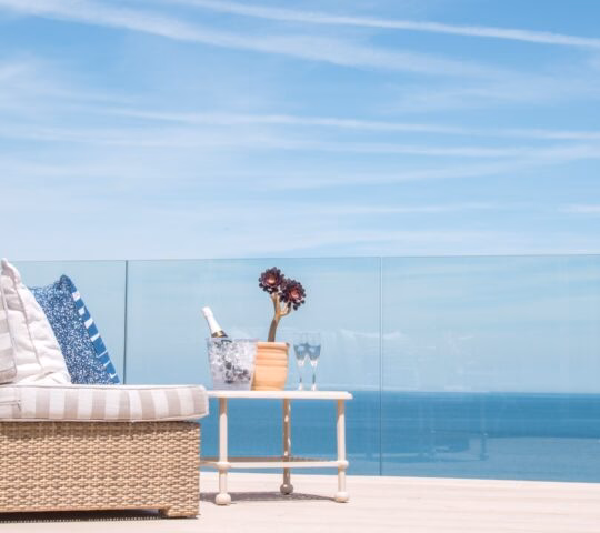 Boskerris Hotel in Cornwall, enjoying the views with some chilled drinks in hand