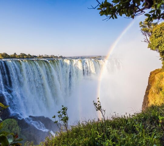 A view of Victoria Falls with a rainbow on the border between Zambia and Zimbabwe.
