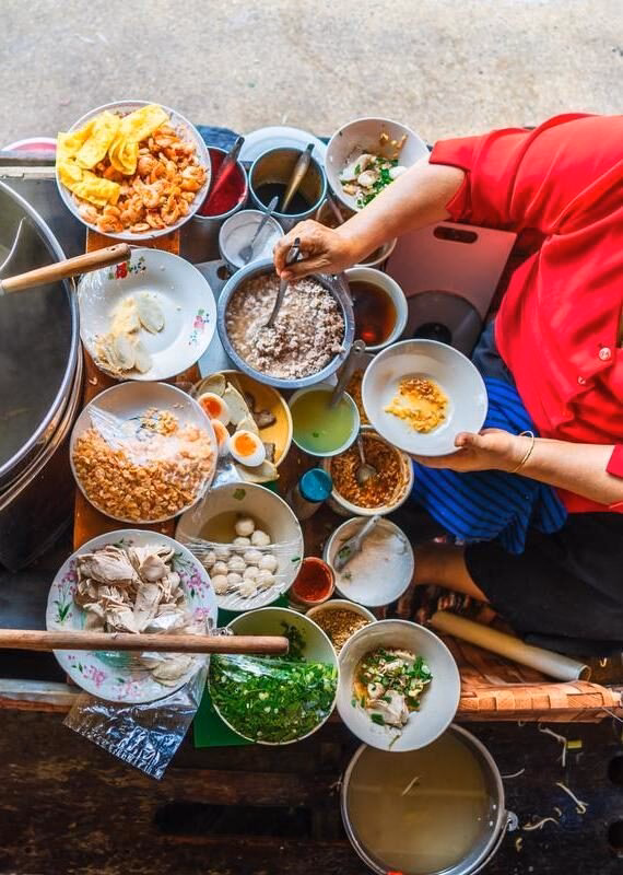 Aerial view of a woman preparing traditional Vietnamese food
