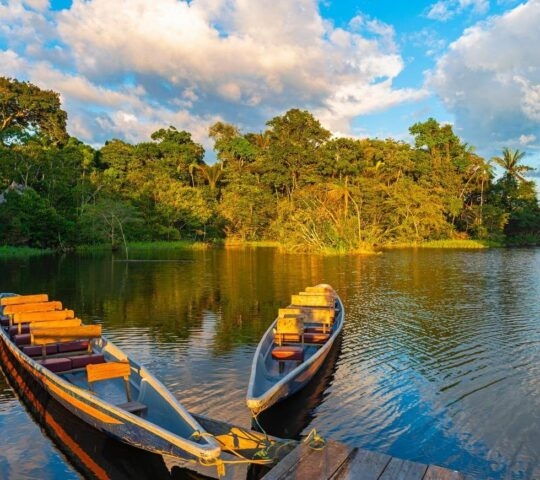 two canoes tied up at the edge of the Amazon river
