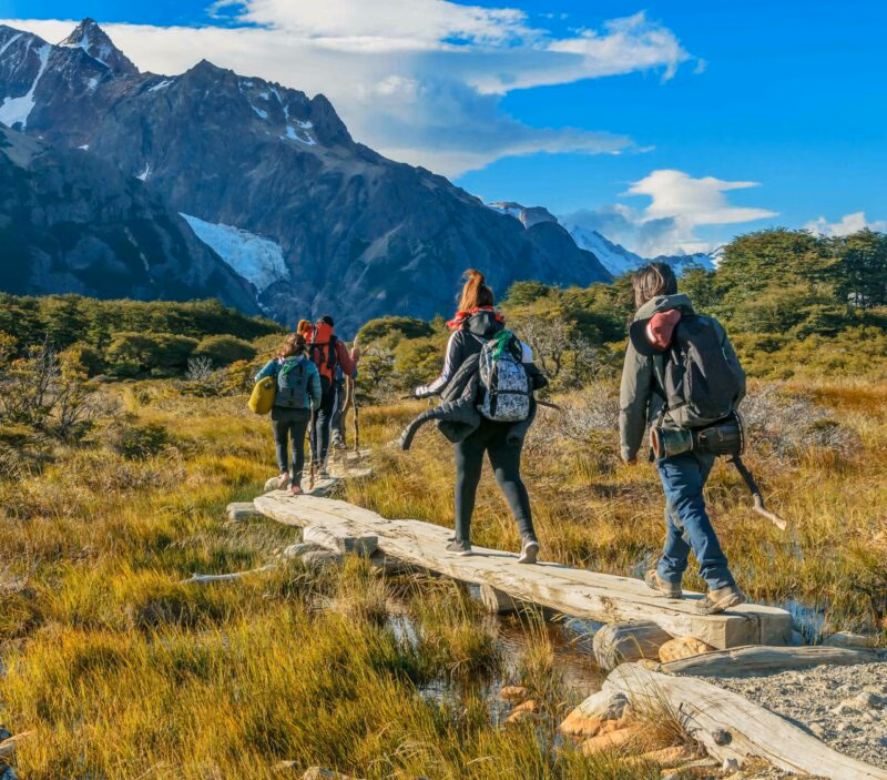 Backpackers walking towards the mountain on a luxury Patagonia holiday