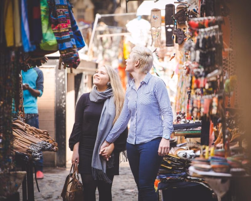 Two women browse a market in Cape Town, South Africa