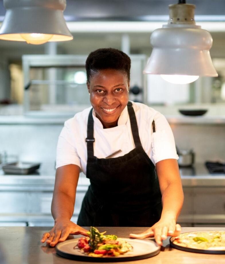 A chef at Singita Community Culinary School and rhino tracking at Wilderness Desert Rhino Camp