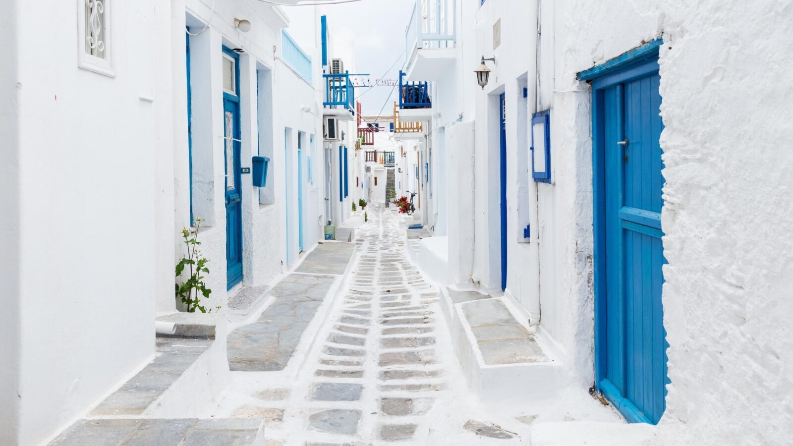 Whitewashed buildings with blue doors in Mykonos town