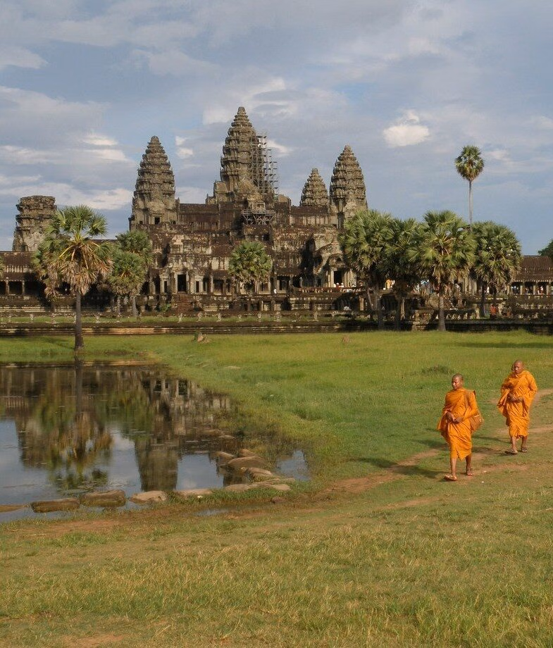 Saffron-robed monks in the sacred temples of Angkor Wat in Cambodia and the lush green rice terraces of Bali, Indonesia.