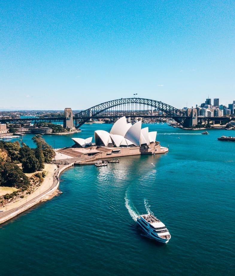 A view of Sydney Opera House, and Wineglass Bay in Tasmania