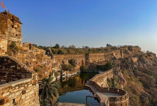 Local women carrying pots with plants at Amber Fort, the intricately detailed facade of Mehrangarh and the sprawling ramparts of Chittorgarh Fort.