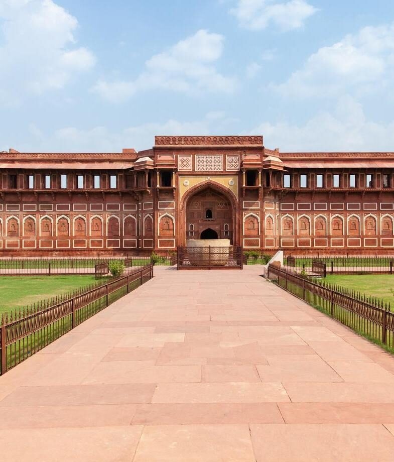 The imposing red sandstone of Agra Fort in Uttar Pradesh and the ornate domes of Mysore Palace.