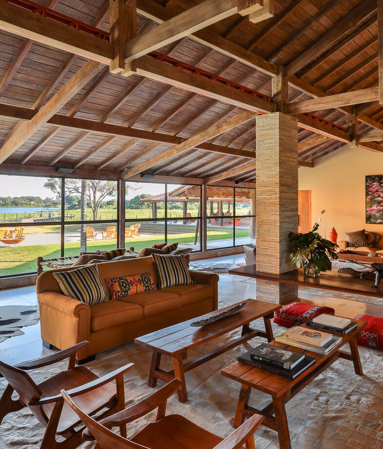 The clear waters of the private beach at Ponta Dos Ganchos and the rustic main lodge at Casa Caiman.