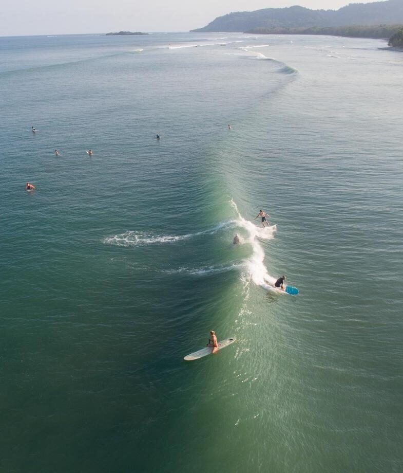 Surfing in the waters off the coast of Jacó and hiking through the cloud forest of Costa Rica.