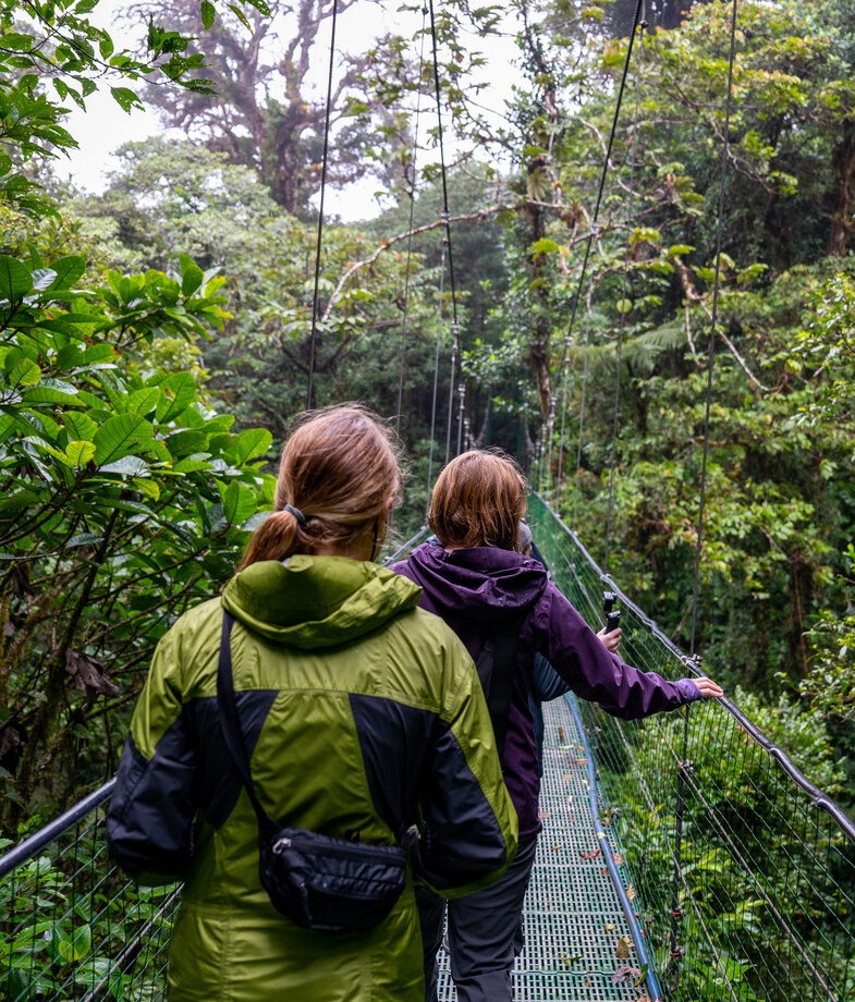 Surfing in the waters off the coast of Jacó and hiking through the cloud forest of Costa Rica.
