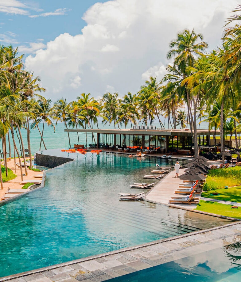 The coastal infinity pool at Carmel Taíba and the chic cocktail bar with sea views at Fasano Rio.