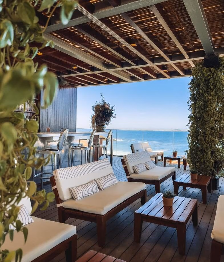 The coastal infinity pool at Carmel Taíba and the chic cocktail bar with sea views at Fasano Rio.