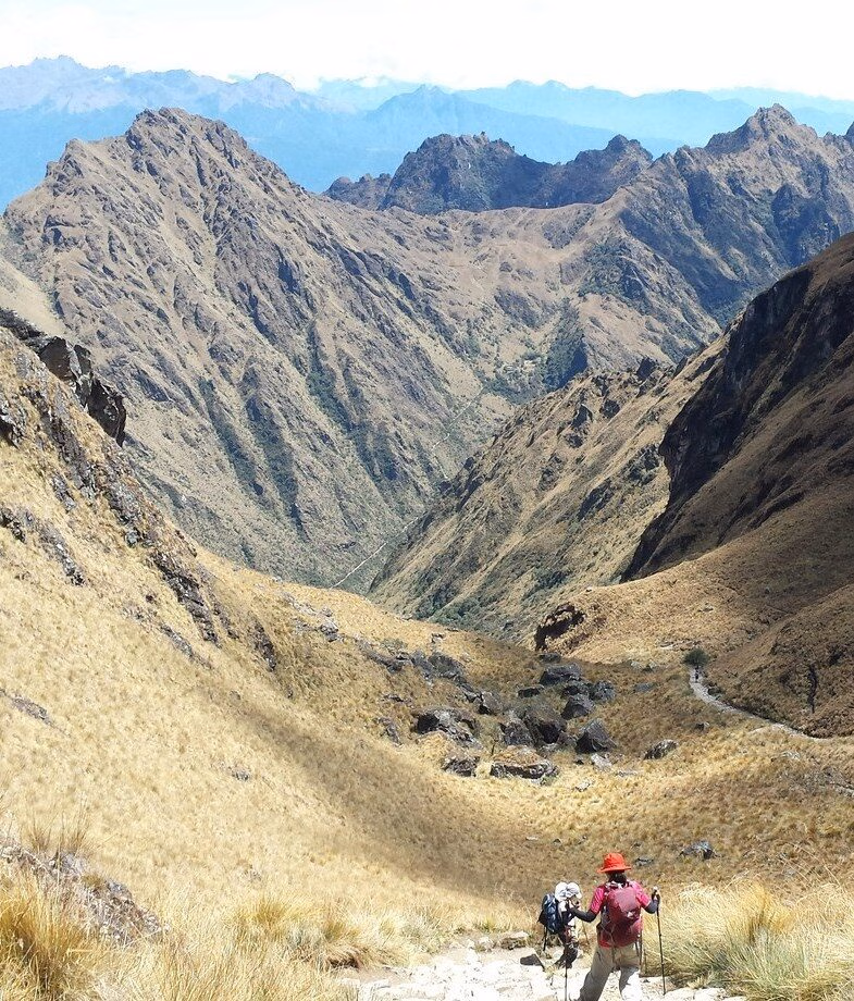 The raked stone paths of the Inka Trail and the towering snow-capped peaks of the Salkantay Trek in Peru.