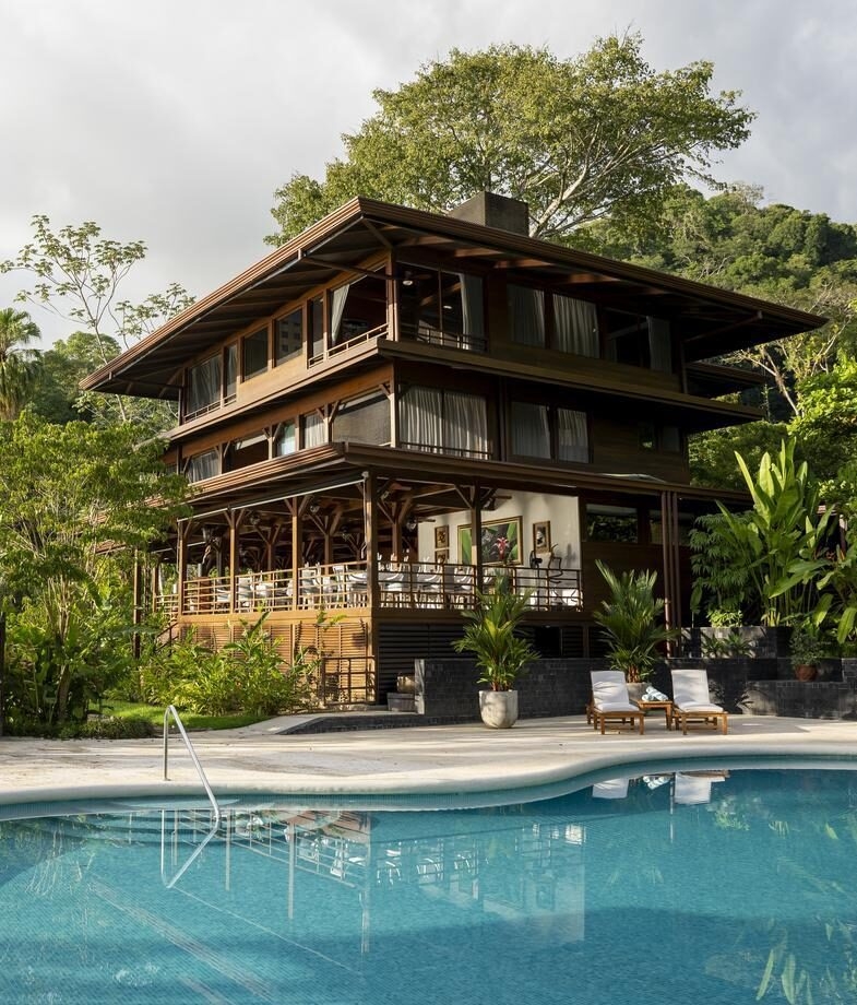 Kayaking through Tortuguero National Park's jungle canals and the main building and pool area at Playa Cativo Lodge on the Osa Peninsula.
