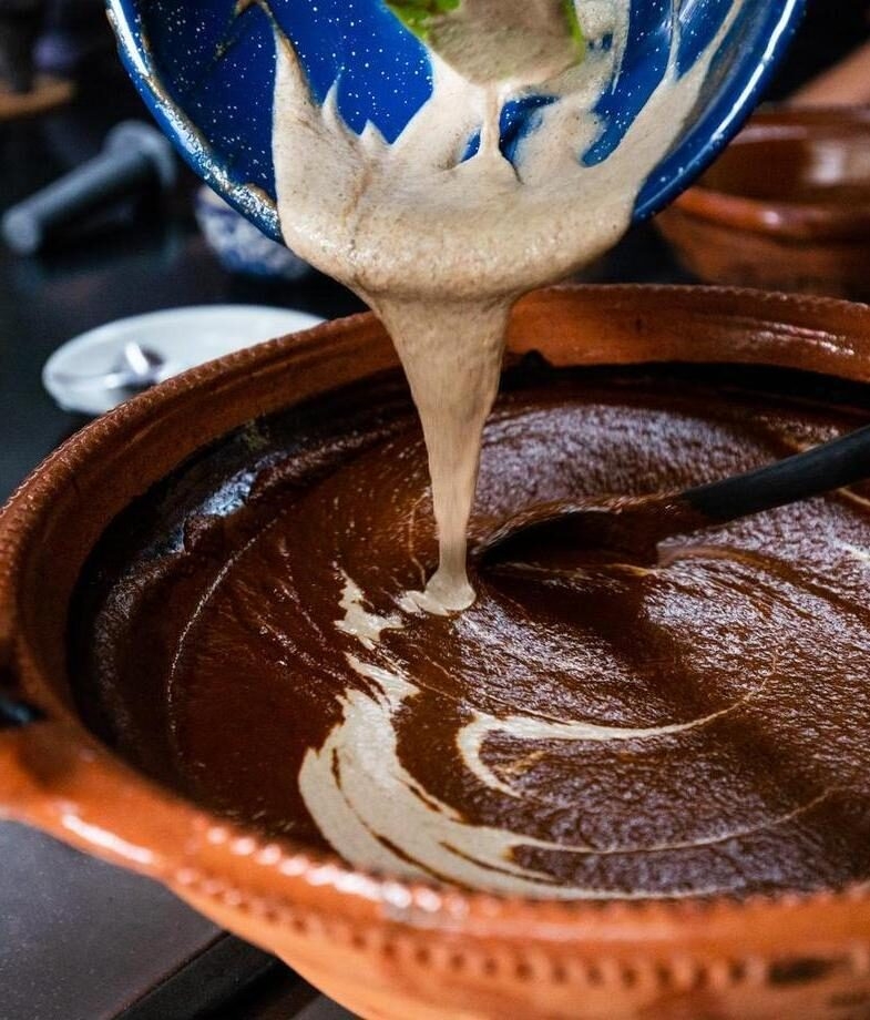 Making mole poblano, and cooking Mexican street food at a market