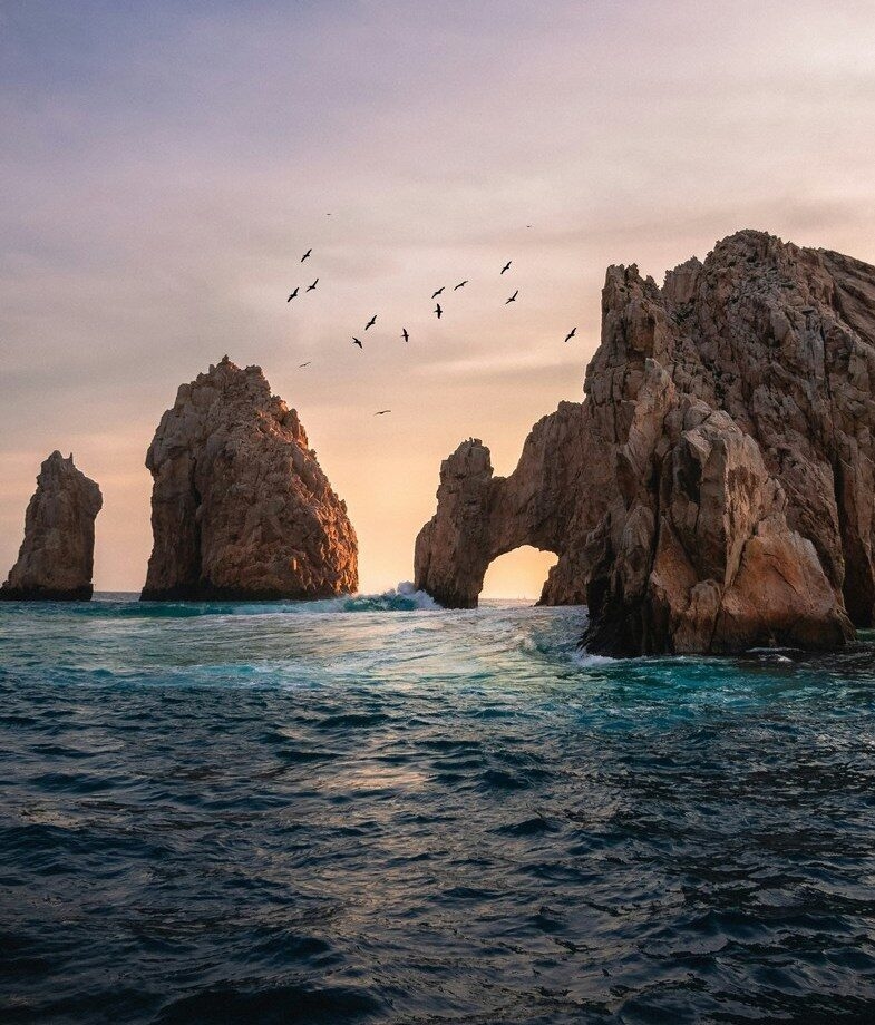 The dramatic rock formations of Land’s End at Playa del Amor during sunset and the aerial view of Isla Mujeres in Quintana Roo.