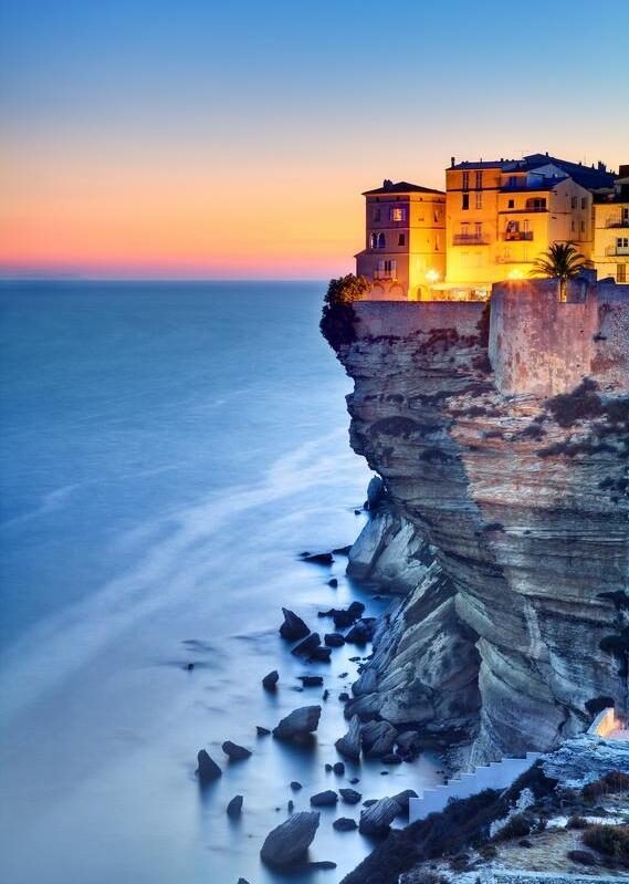 Cliffside buildings of Bonifacio in Corsica at sunset