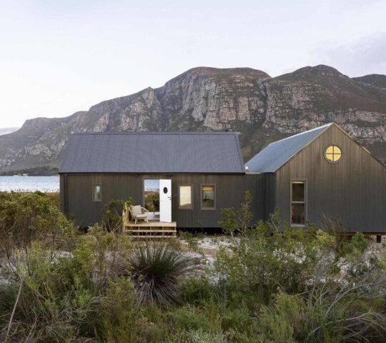 A private boathouse at Coot Club with the Maanschynkop mountains in the background.