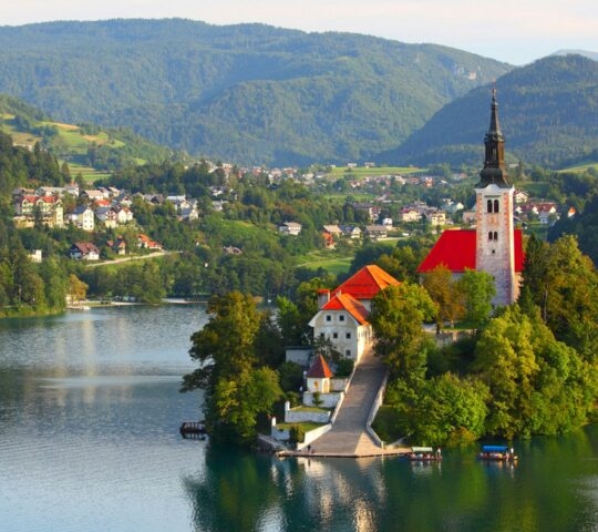 Santa-Maria-Church-on-Bled-lake Slovenia surrounded by the lake