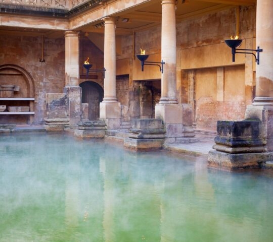 Steam rising from the main pool of the ancient Roman baths in Bath