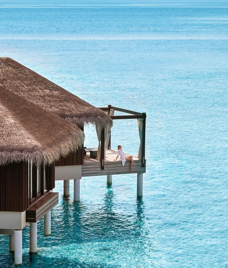 Relax at an overwater villa at Velaa Private Island, or amongst the trees at &Beyond Mnemba Island
