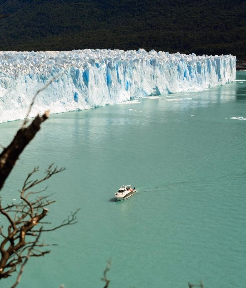 Our Jacada team trying on Carnival costumes in Brazil and a yacht cruising the Perito Moreno Glacier in Patagonia.