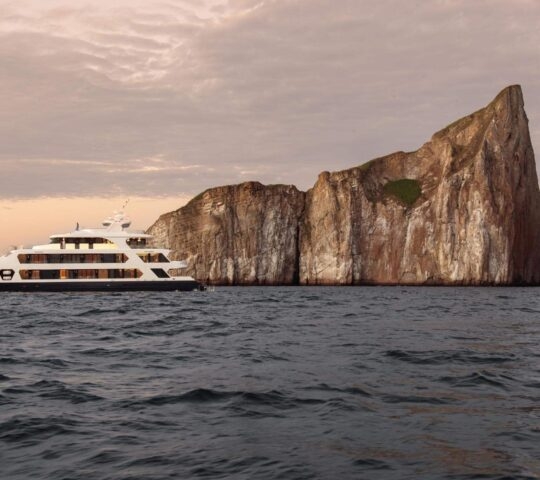 Panorama of Hermes catamaran cruising in the Galapagos.