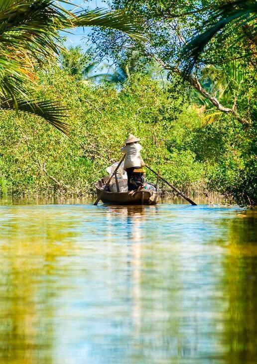 A traditional wooden boat floats down the Mekong river, visit Reteti Elephant Sanctuary while staying at Sarara Camp and the stunning Seville skyline glowing under a winter sun