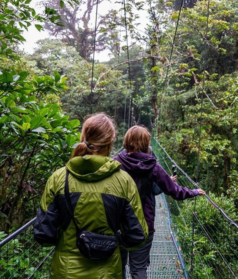 A family enjoys a lovely walk across Costa Rica’s rainforest canopy and, in Panama’s Gulf of Chiriquí, unwind on a beautiful jungle-fringed beach.
